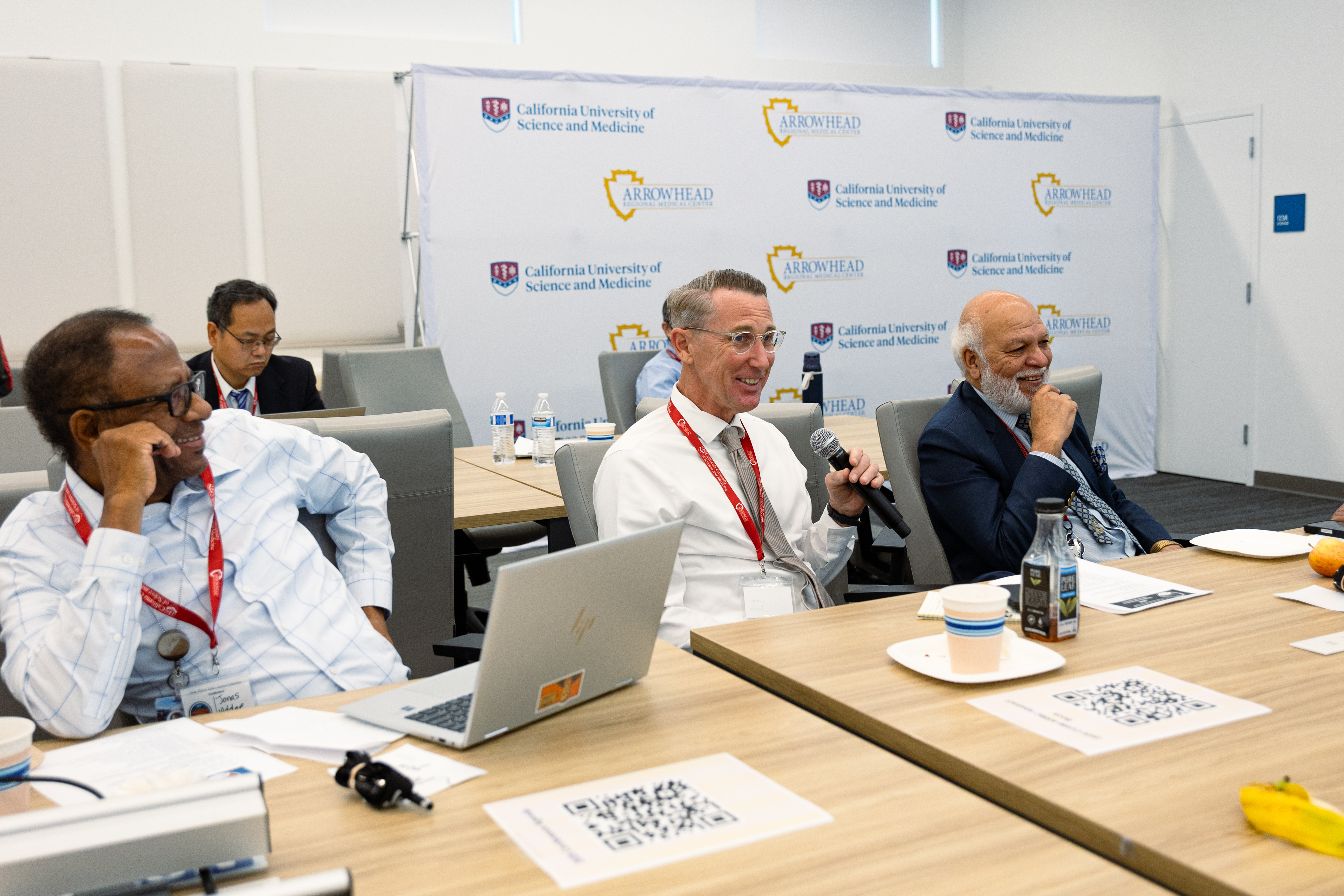 Professors attending the research symposium